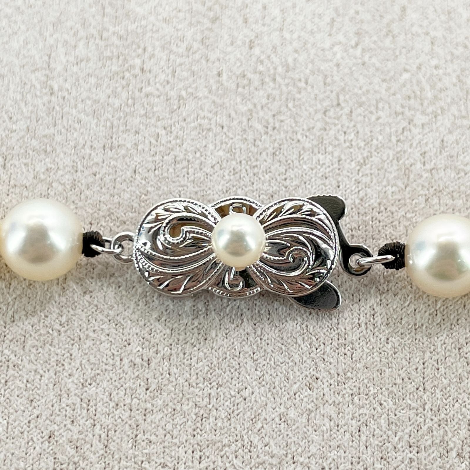 Mikimoto Akoya Pearl Silver Necklace model 24-2988 displayed with pearls and silver chain in jewelry box