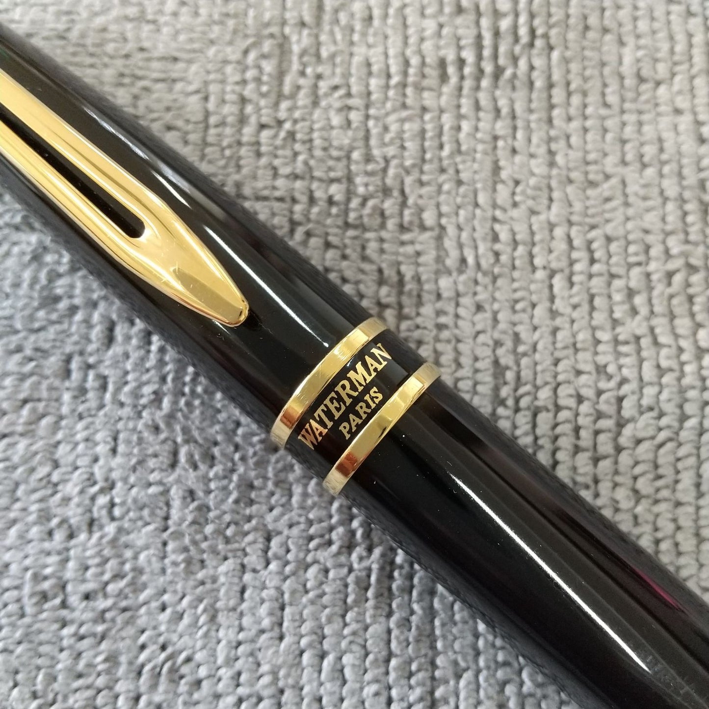 Used Waterman ballpoint pen and fountain pen set showing aged wear and ink residue