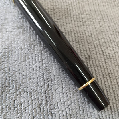 Used Waterman ballpoint pen and fountain pen set showing aged wear and ink residue