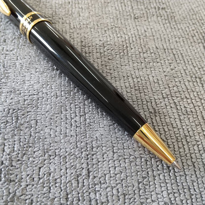 Used Waterman ballpoint pen and fountain pen set showing aged wear and ink residue