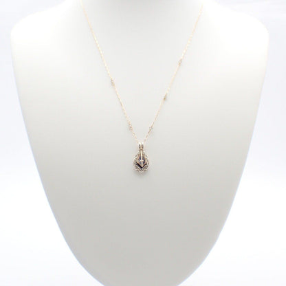 Agete two-way necklace with K10 silver, felspar, labradorite and purple goldstone on a white background