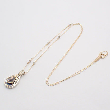 Agete two-way necklace with K10 silver, felspar, labradorite and purple goldstone on a white background