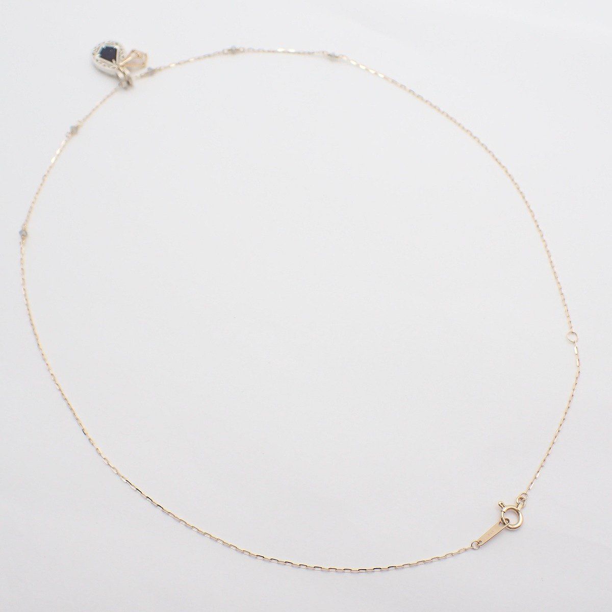 Agete two-way necklace with K10 silver, felspar, labradorite and purple goldstone on a white background