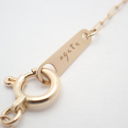 Agete two-way necklace with K10 silver, felspar, labradorite and purple goldstone on a white background