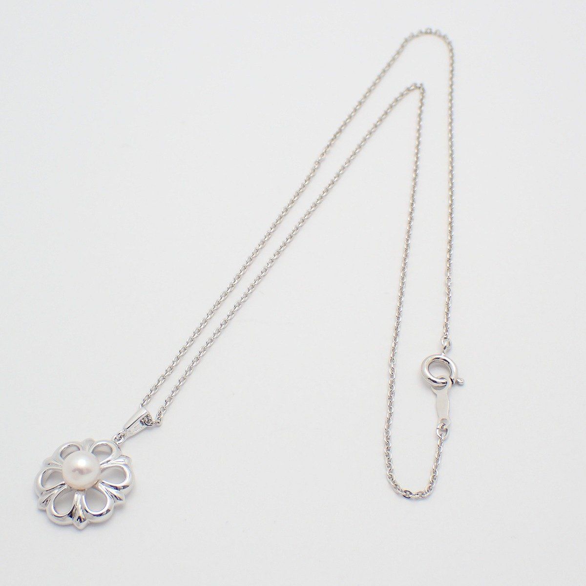 Mikimoto Flower Necklace featuring silver chain with delicate pearl flower pendant