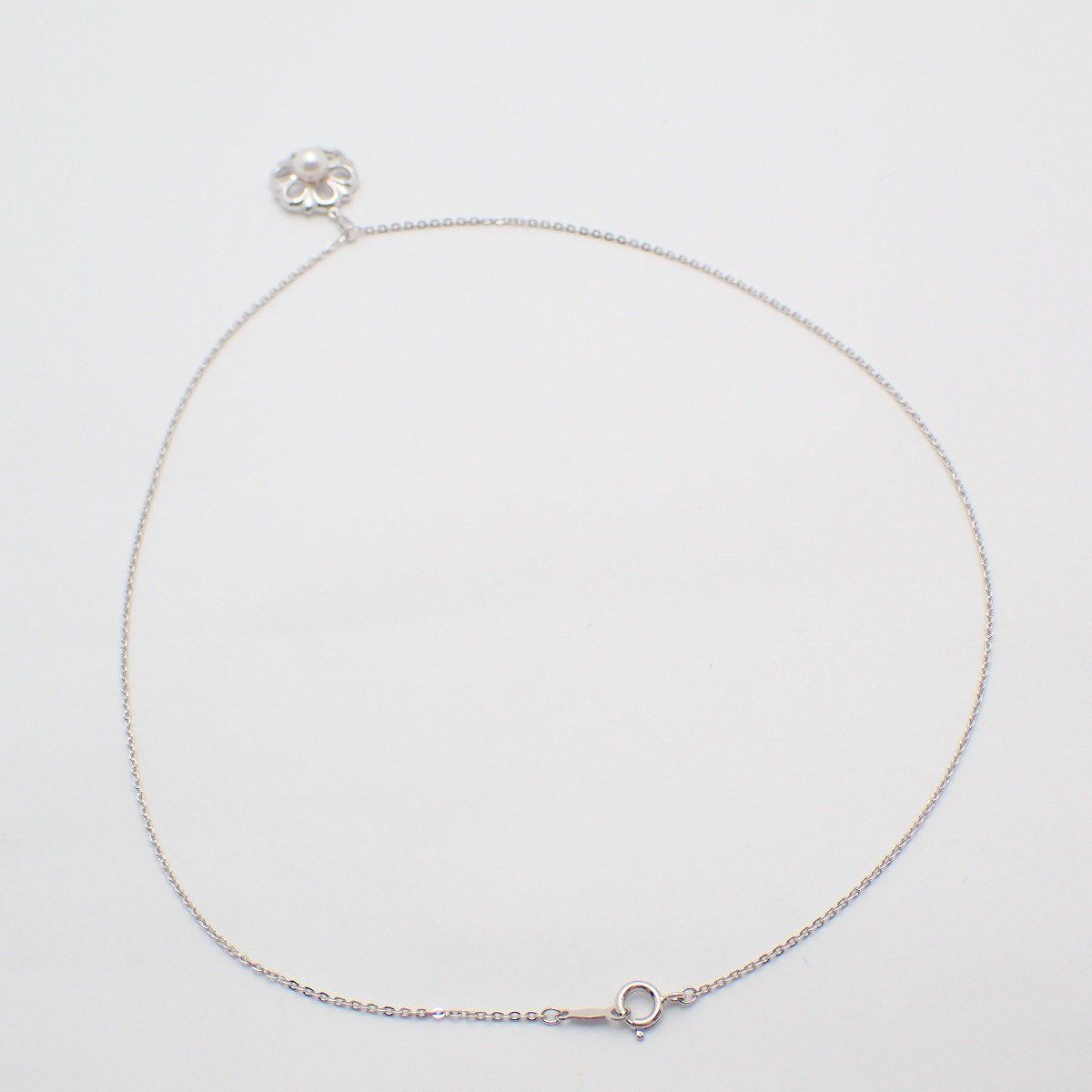 Mikimoto Flower Necklace featuring silver chain with delicate pearl flower pendant