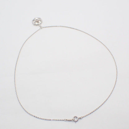 Mikimoto Flower Necklace featuring silver chain with delicate pearl flower pendant