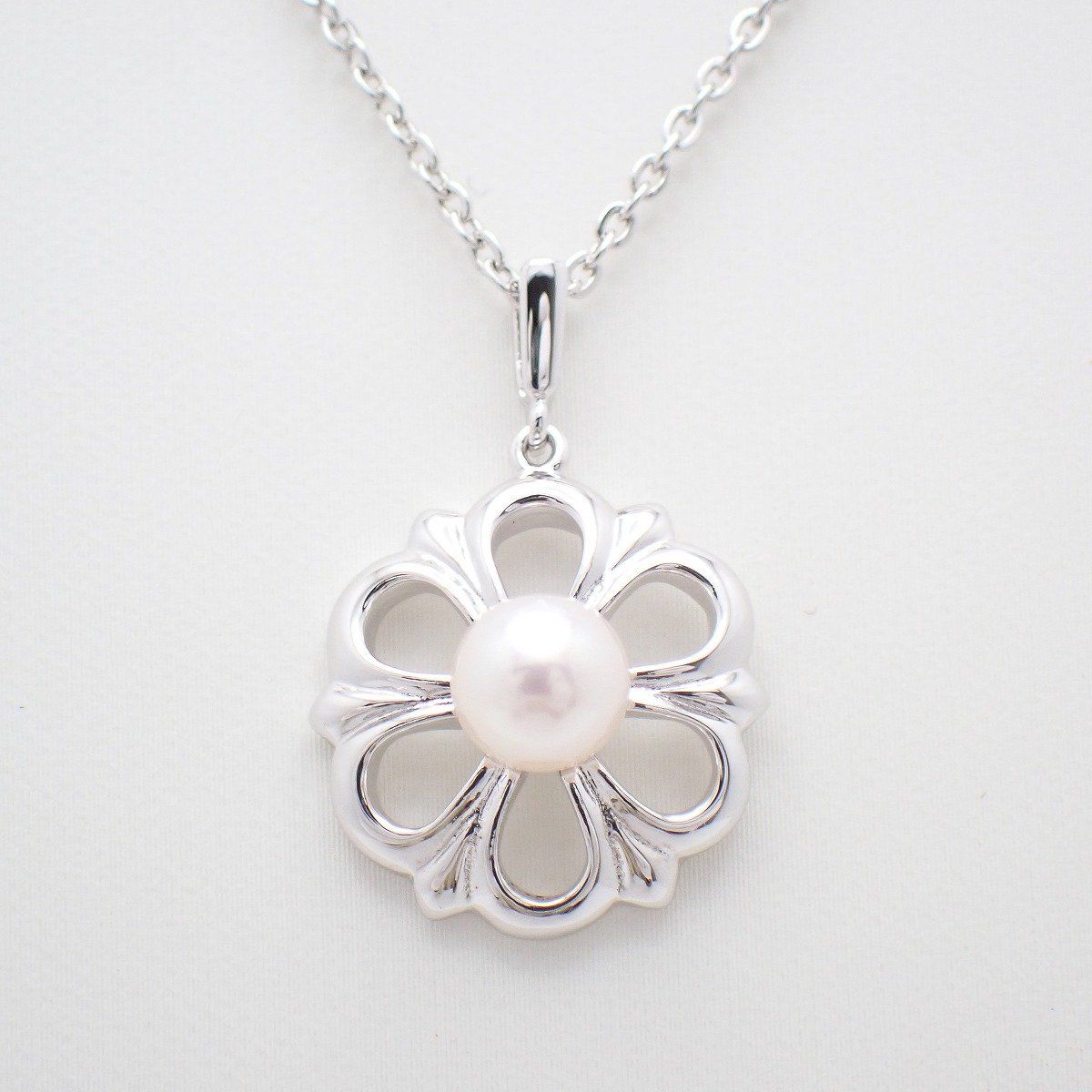 Mikimoto Flower Necklace featuring silver chain with delicate pearl flower pendant