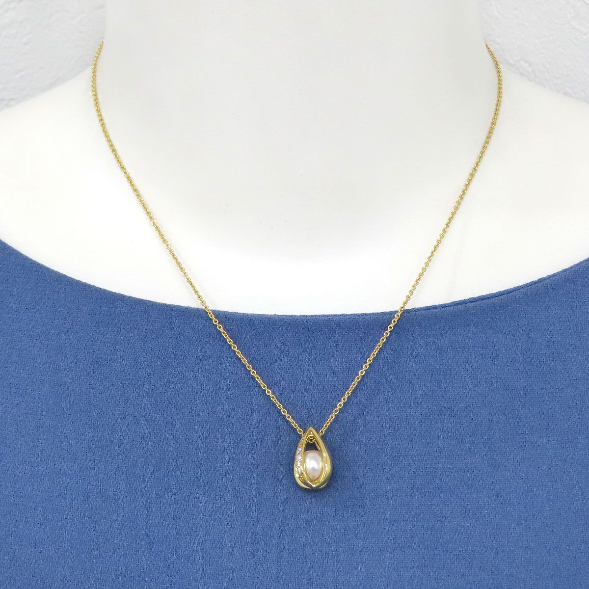 Mikimoto Akoya pearl teardrop diamond necklace with 40cm chain and 7.1mm pearl diameter displayed