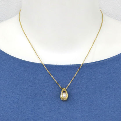 Mikimoto Akoya pearl teardrop diamond necklace with 40cm chain and 7.1mm pearl diameter displayed