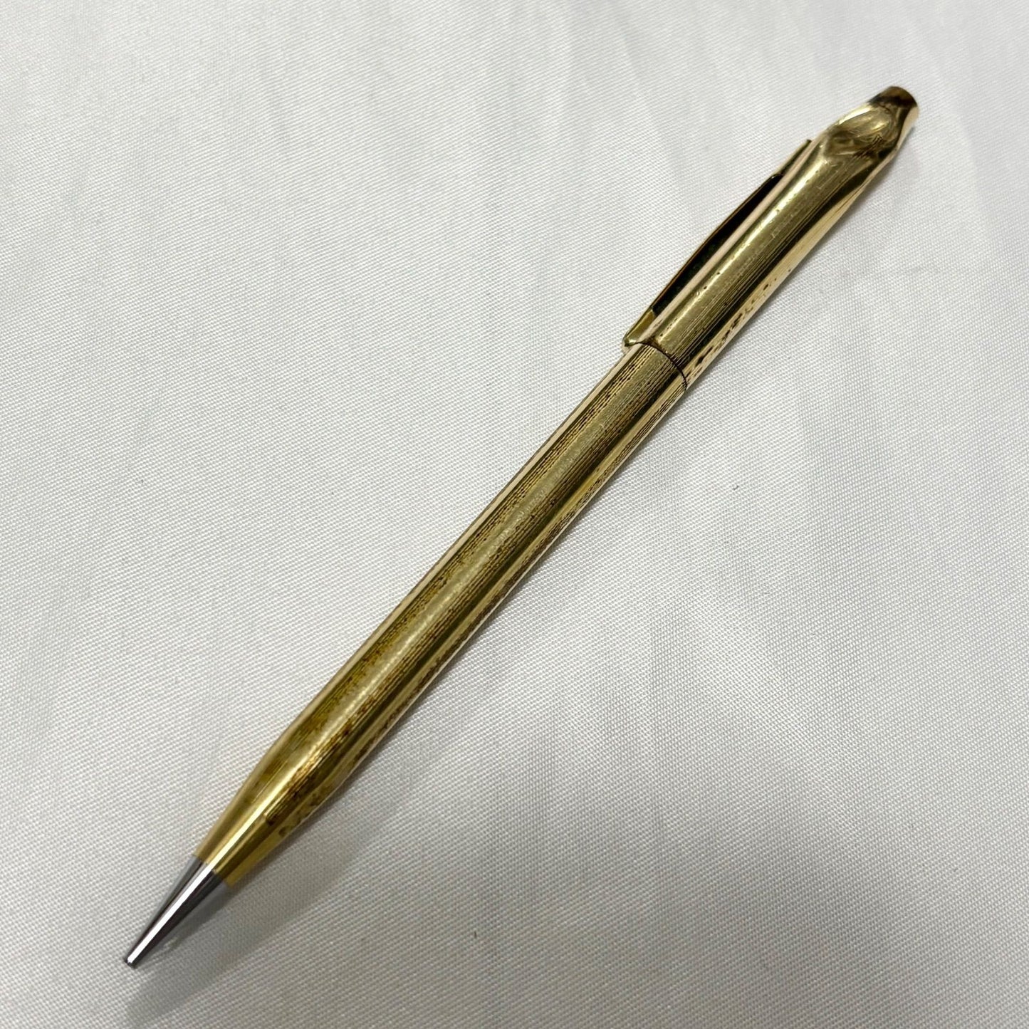 Gold Cross Century Classic mechanical pencil with minor scratches and dents shown