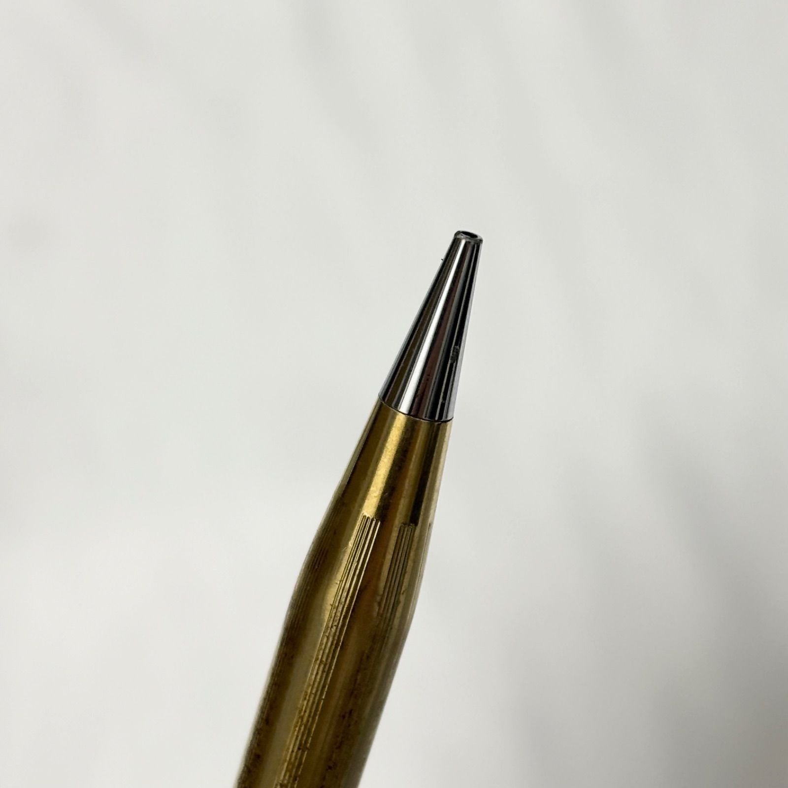 Gold Cross Century Classic mechanical pencil with minor scratches and dents shown