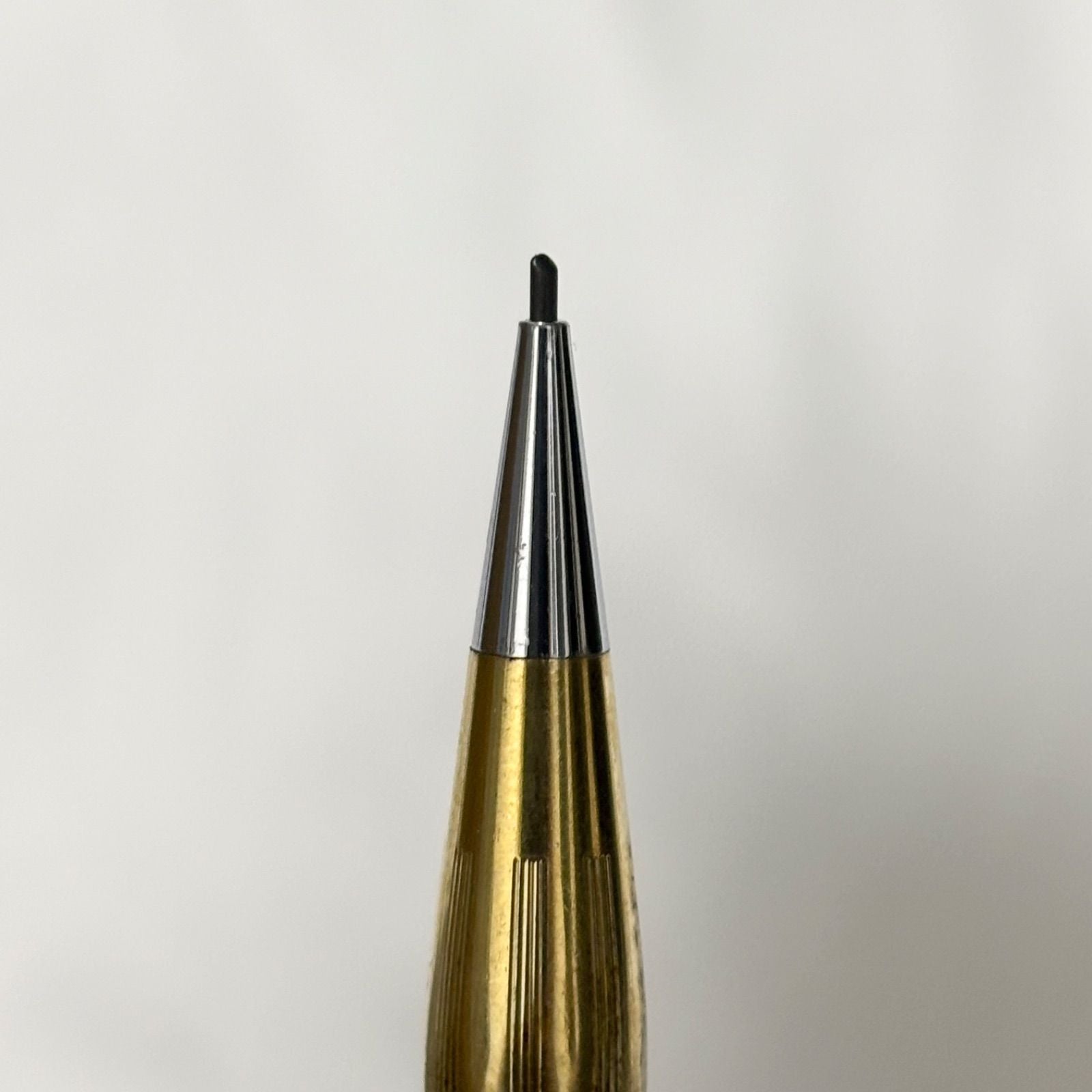 Gold Cross Century Classic mechanical pencil with minor scratches and dents shown