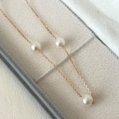 094TasakiK18 pearl 5-string station necklace displayed with box and warranty