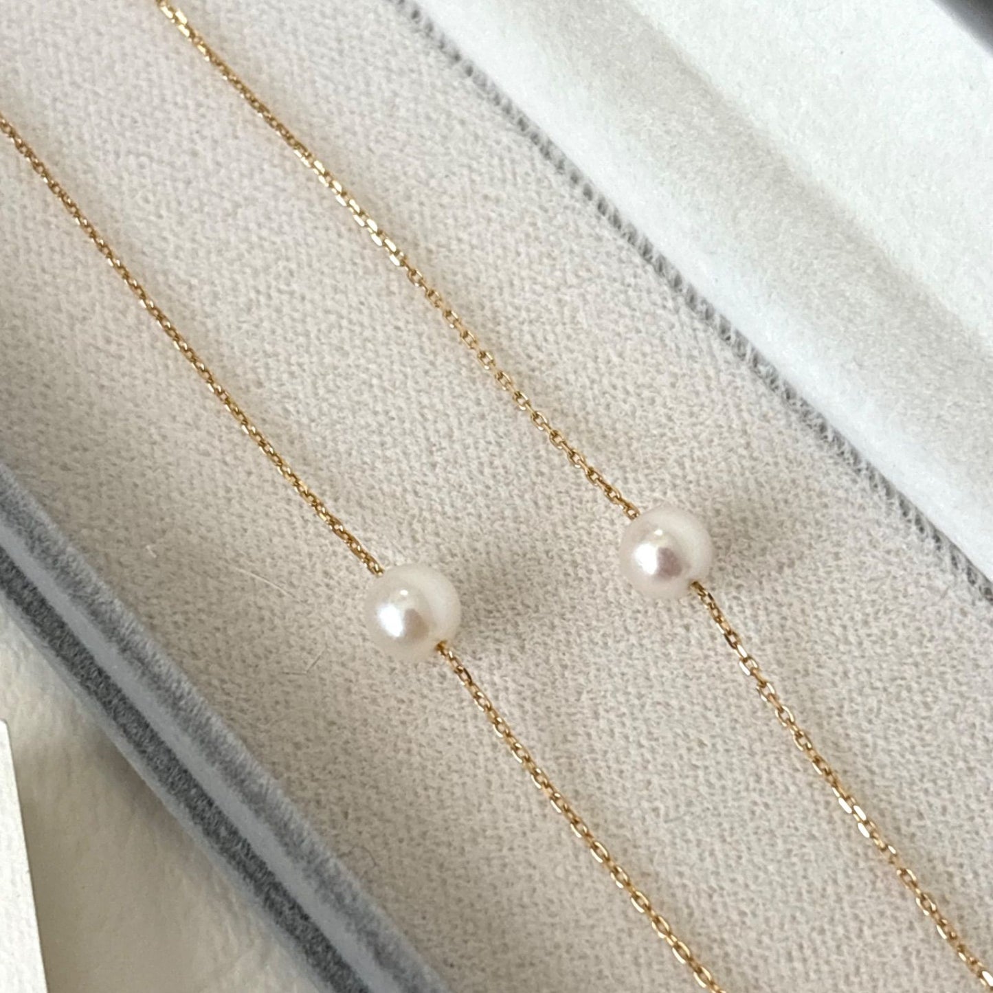 094TasakiK18 pearl 5-string station necklace displayed with box and warranty