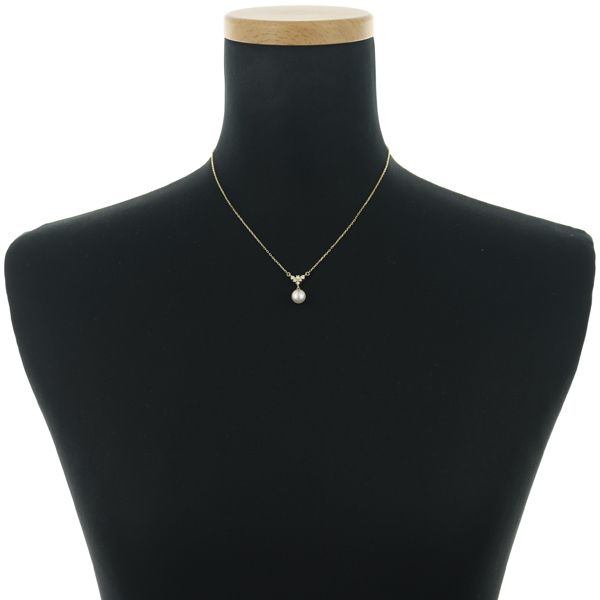 Mikimoto necklace featuring a 7.6mm Akoya pearl pendant with diamond accents set in 18K yellow gold on a 39cm chain