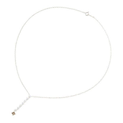Mikimoto white gold diamond necklace with 7 round cut and 1 square cut diamonds, 40 cm length