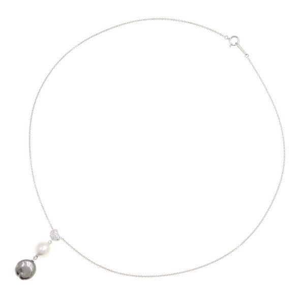 Mikimoto Baroque Pearl Necklace in white gold with white and kuro pearls featuring butterfly motif