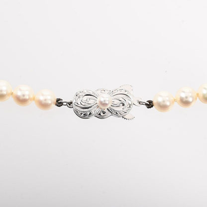 Mikimoto pearl necklace featuring 5.5-6mm pearls on a 38.5cm silver chain