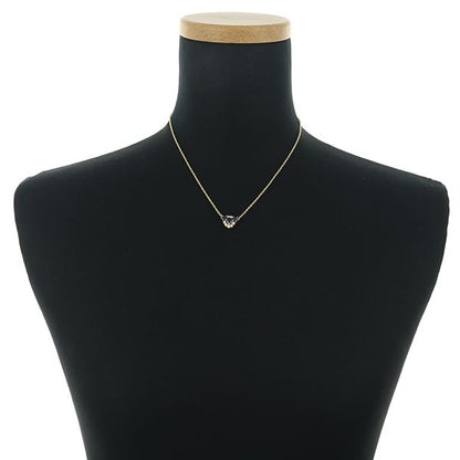 Mikimoto necklace with sapphire and diamond pendant set in 18K yellow gold, showing detailed gemstones and chain