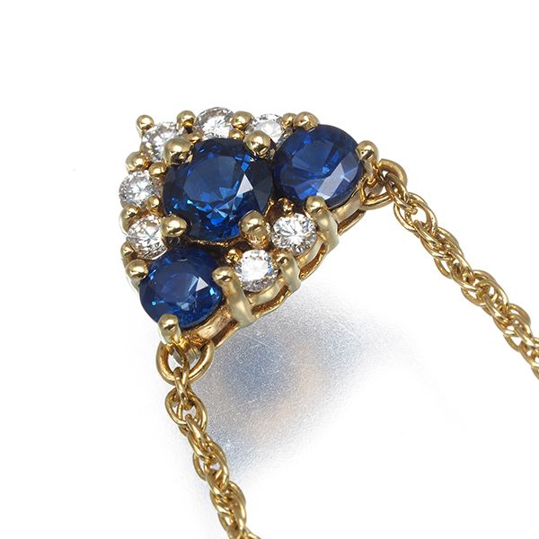 Mikimoto necklace with sapphire and diamond pendant set in 18K yellow gold, showing detailed gemstones and chain