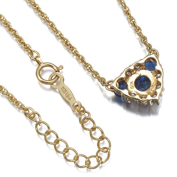 Mikimoto necklace with sapphire and diamond pendant set in 18K yellow gold, showing detailed gemstones and chain