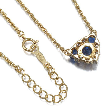 Mikimoto necklace with sapphire and diamond pendant set in 18K yellow gold, showing detailed gemstones and chain