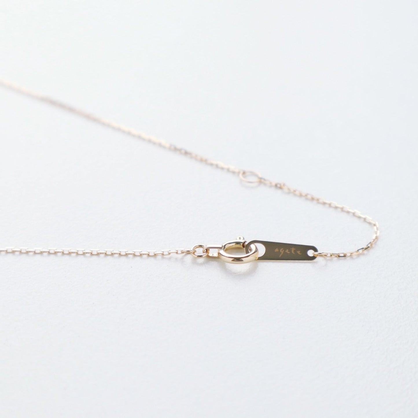 Agete K18 yellow gold necklace with 0.05ct diamond charm measuring 0.3 cm square and 38cm chain length