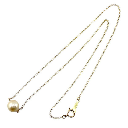 Mikimoto 18K yellow gold ladies necklace featuring a single pearl pendant