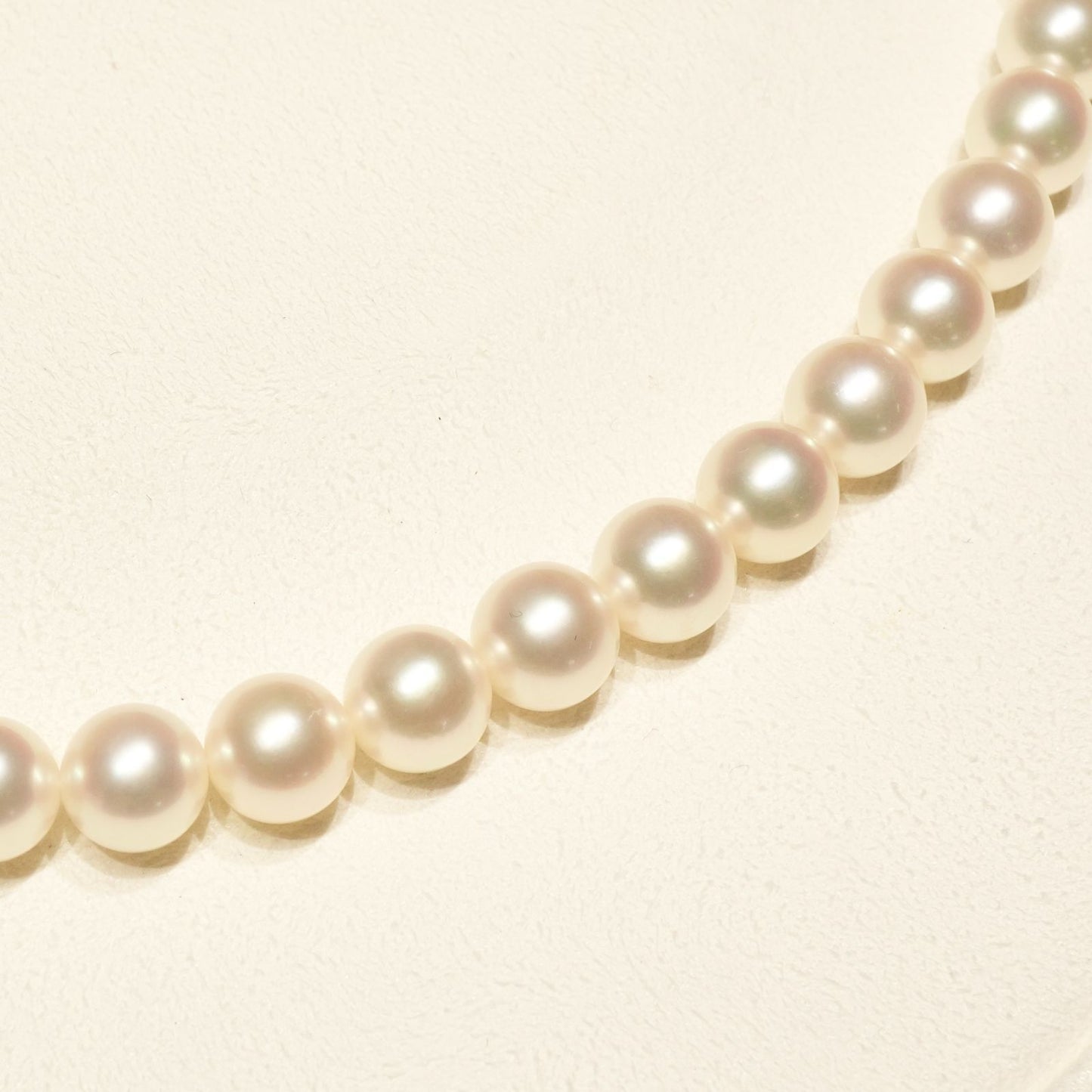 Mikimoto K14WG Akoya Pearl Necklace featuring white pearls sized 6.6 to 6.9 mm on a sterling white gold chain