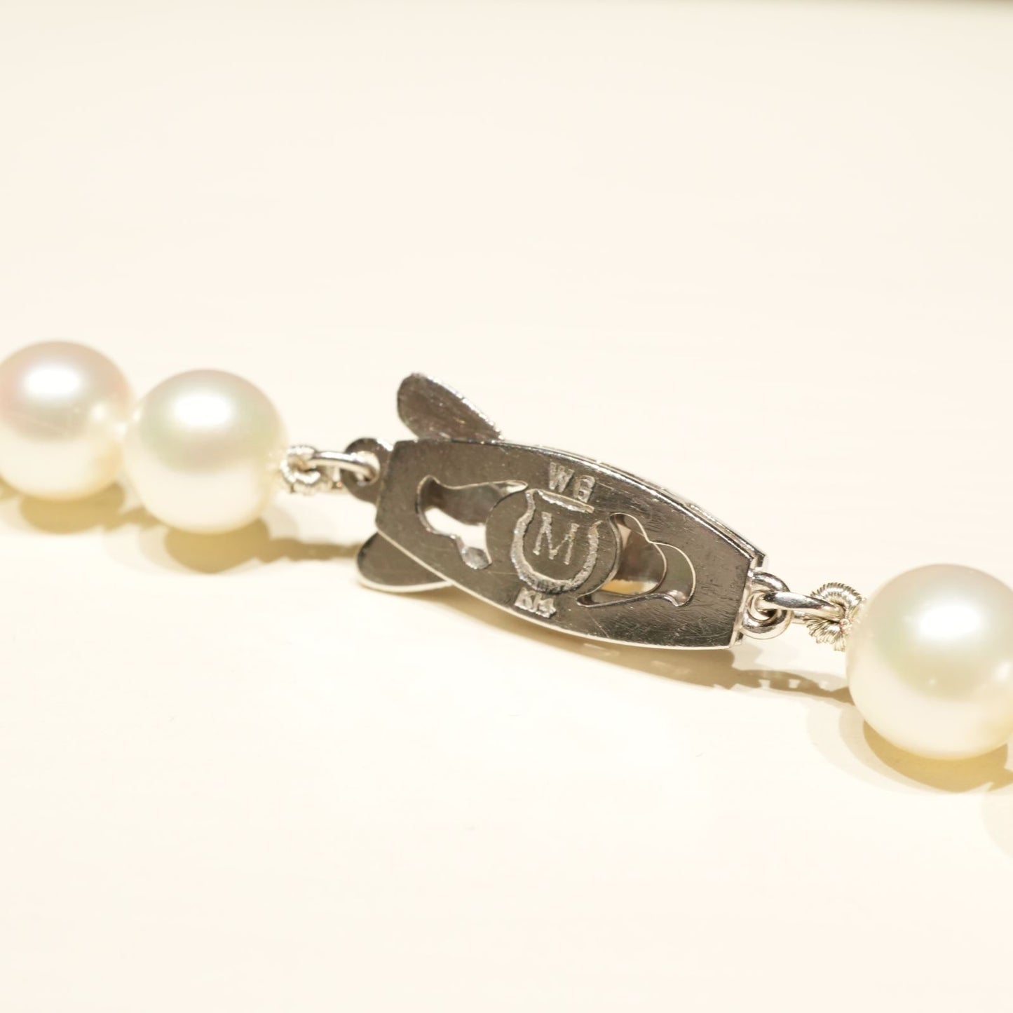 Mikimoto K14WG Akoya Pearl Necklace featuring white pearls sized 6.6 to 6.9 mm on a sterling white gold chain