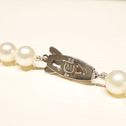 Mikimoto K14WG Akoya Pearl Necklace featuring white pearls sized 6.6 to 6.9 mm on a sterling white gold chain