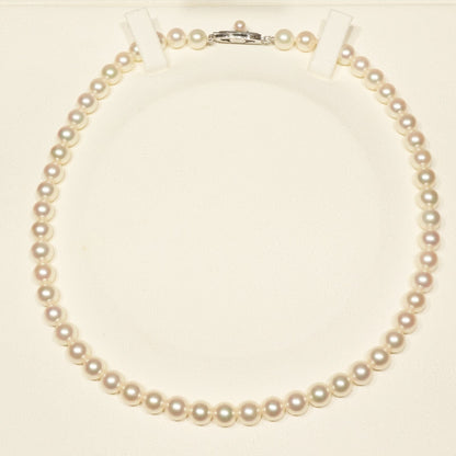 Mikimoto K14WG Akoya Pearl Necklace featuring white pearls sized 6.6 to 6.9 mm on a sterling white gold chain