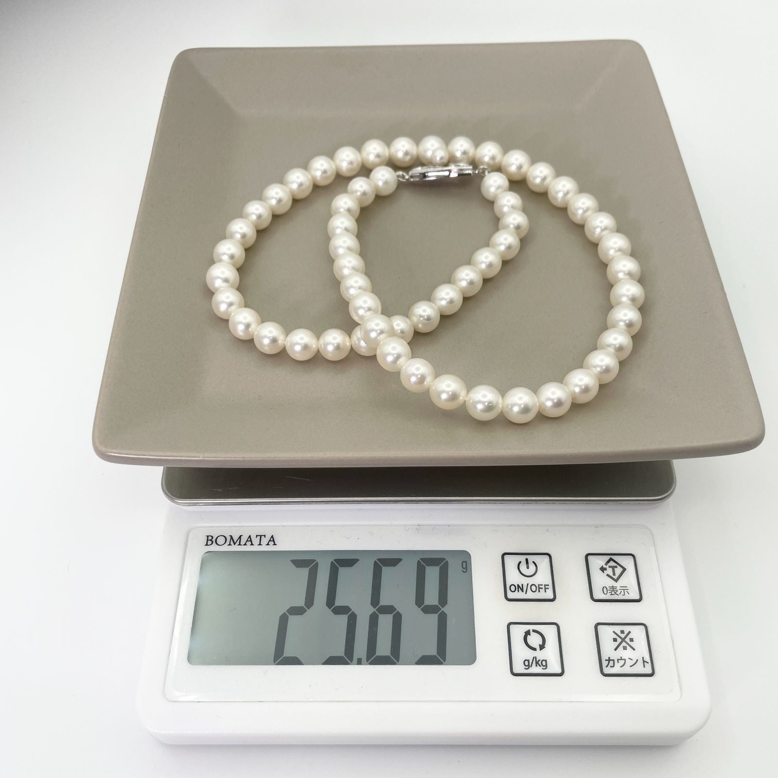 Mikimoto K14WG Akoya Pearl Necklace featuring white pearls sized 6.6 to 6.9 mm on a sterling white gold chain