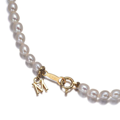 Mikimoto baby pearl necklace in 18k yellow gold featuring pearls sized 3.5-7.2mm on a 40cm chain