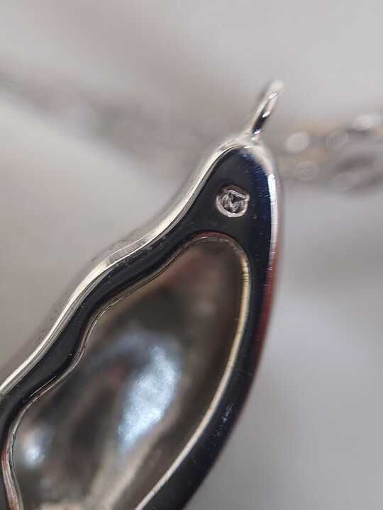 Mikimoto silver necklace with a pearl and butterfly pendant on a 41 cm chain