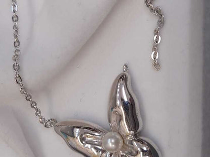 Mikimoto silver necklace with a pearl and butterfly pendant on a 41 cm chain