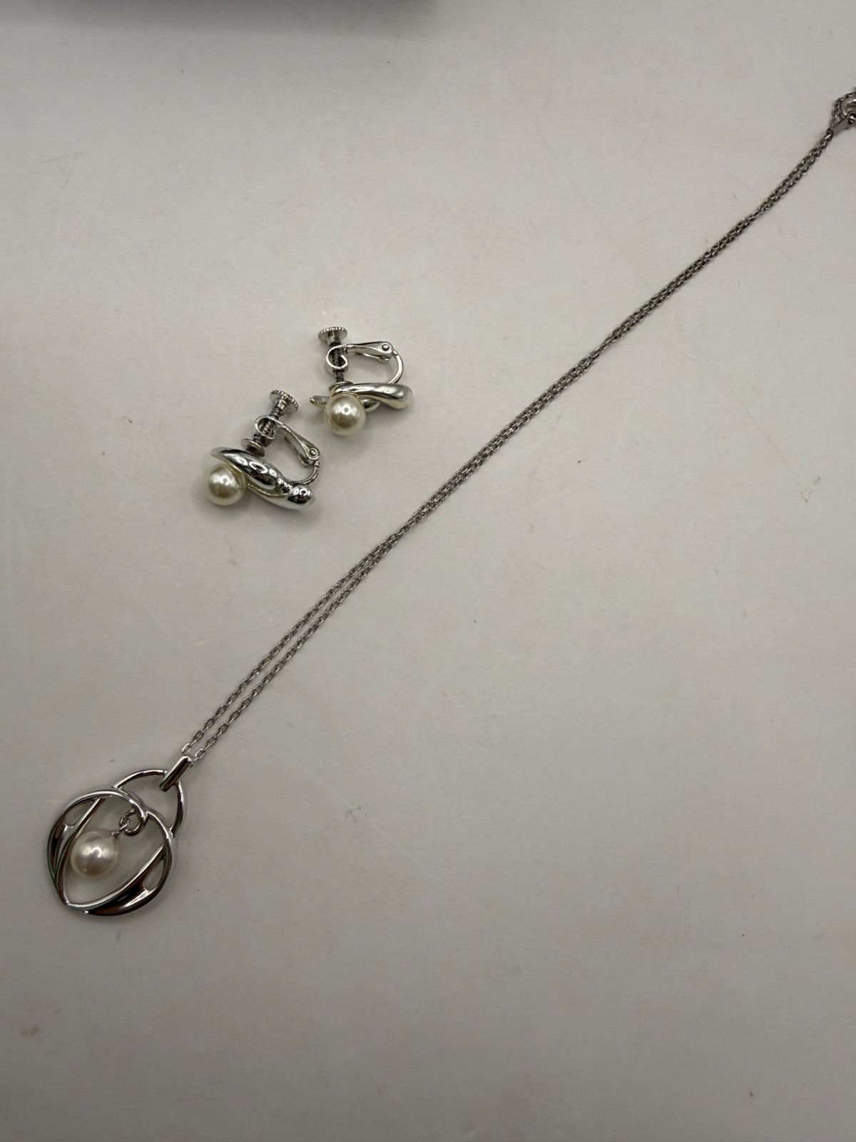 Used Mikimoto Akoya pearl necklace and matching earrings set in sterling silver with M within M logo