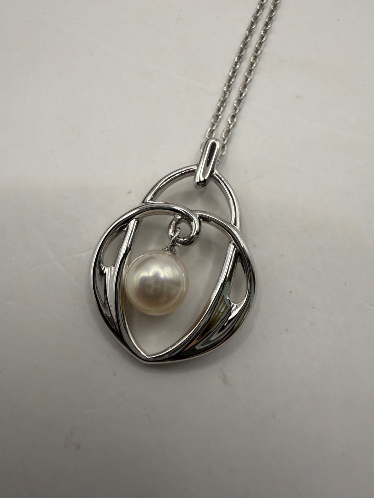 Used Mikimoto Akoya pearl necklace and matching earrings set in sterling silver with M within M logo
