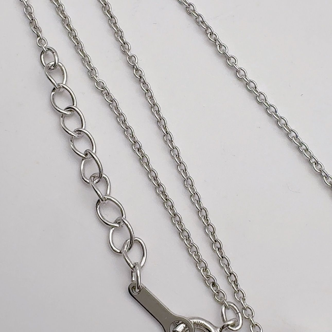 Tasaki pearl necklace featuring 6.2mm pearls, 41.5cm chain, and 1.1cm by 3.4cm pendant
