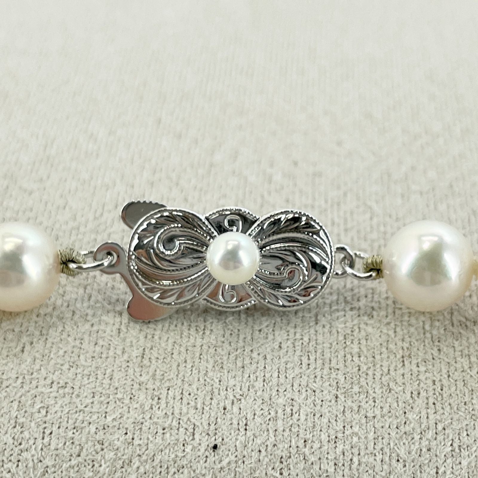 Beautiful Mikimoto pearl necklace with silver chain, model 24-2158M, detailed pearls visible