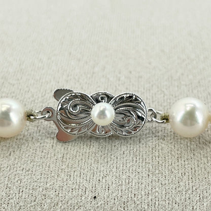 Beautiful Mikimoto pearl necklace with silver chain, model 24-2158M, detailed pearls visible