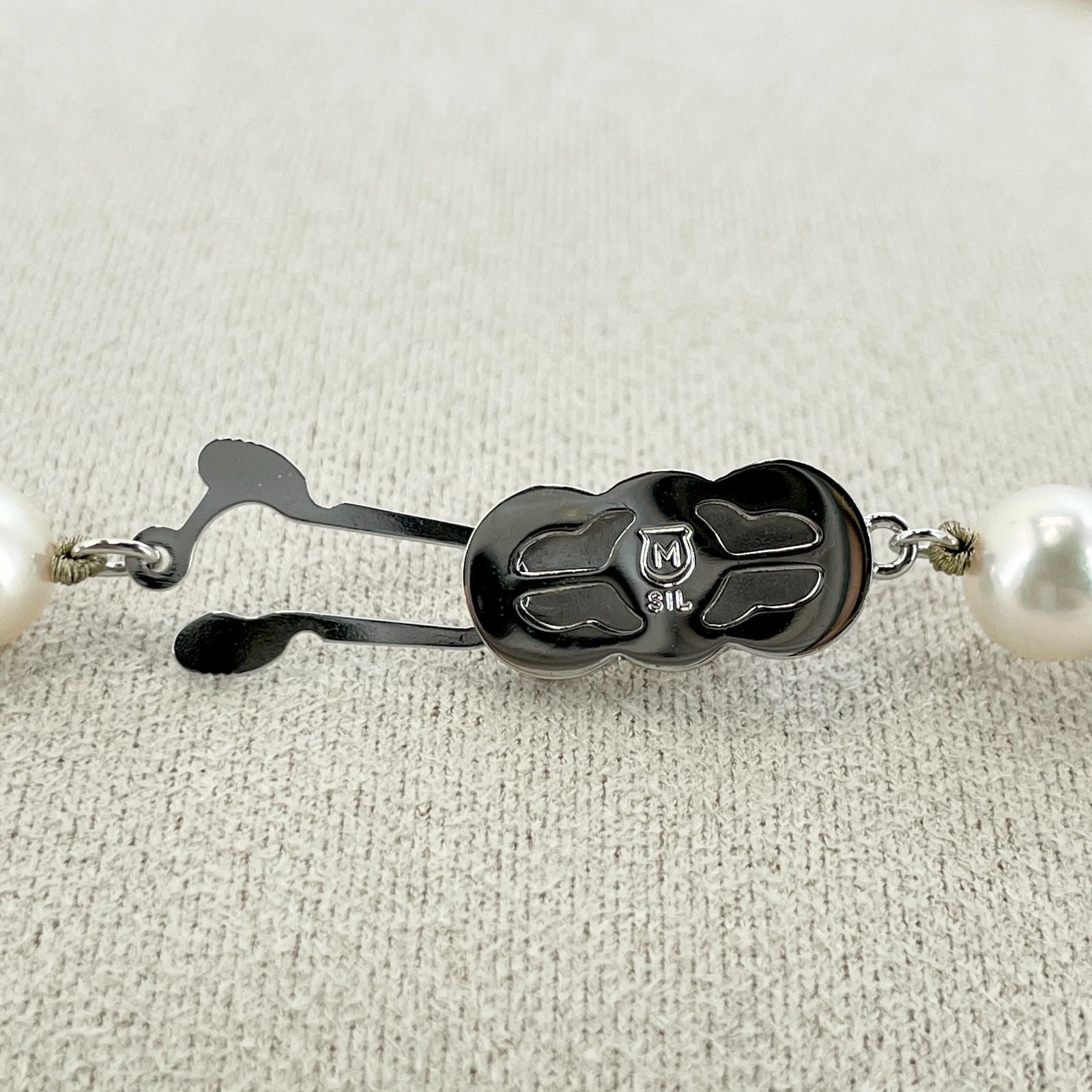 Beautiful Mikimoto pearl necklace with silver chain, model 24-2158M, detailed pearls visible