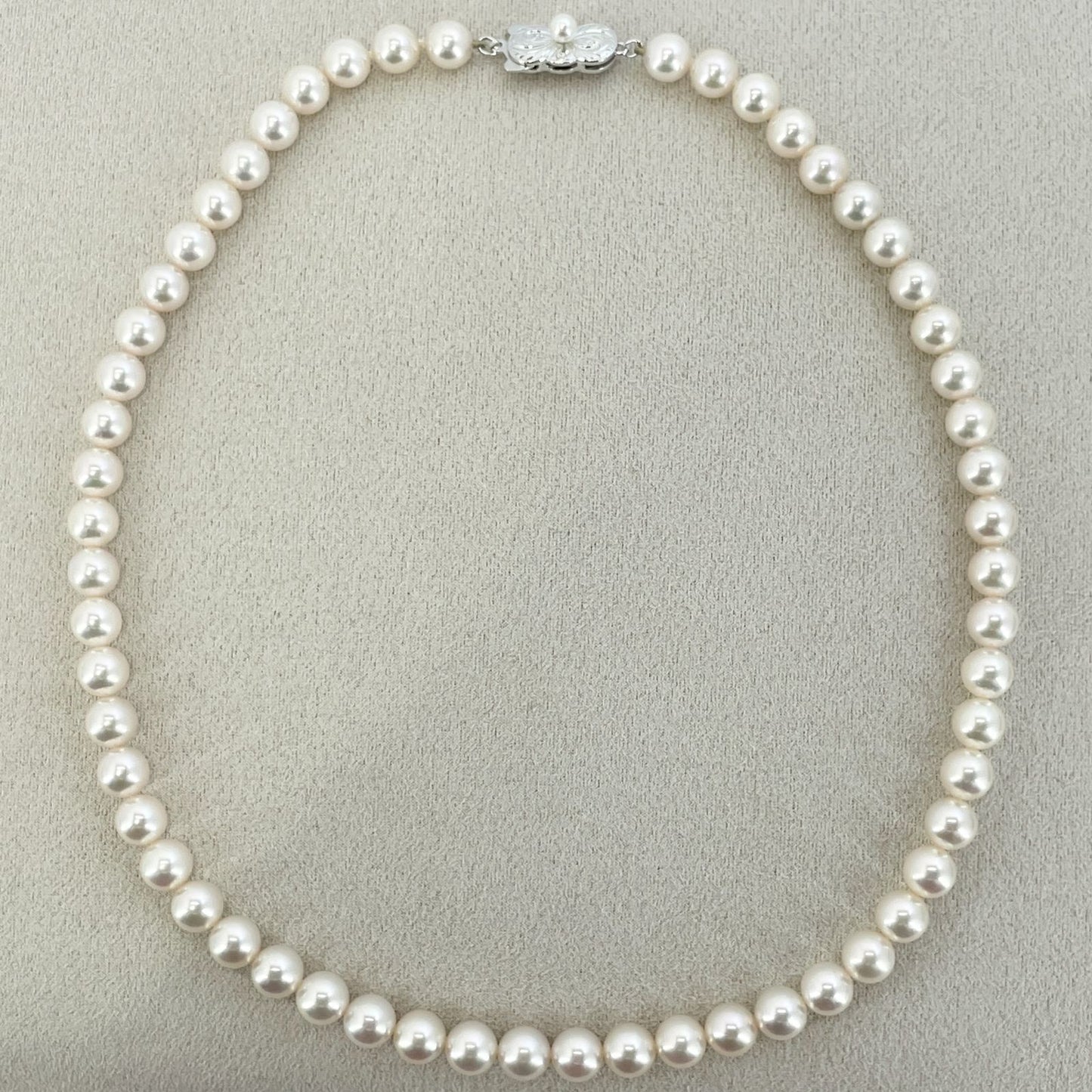 Beautiful Mikimoto pearl necklace with silver chain, model 24-2158M, detailed pearls visible