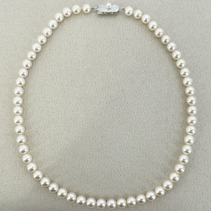 Beautiful Mikimoto pearl necklace with silver chain, model 24-2158M, detailed pearls visible