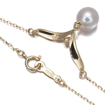 Mikimoto 7.0mm pearl necklace with diamond accents set in 18K yellow gold, 42cm length