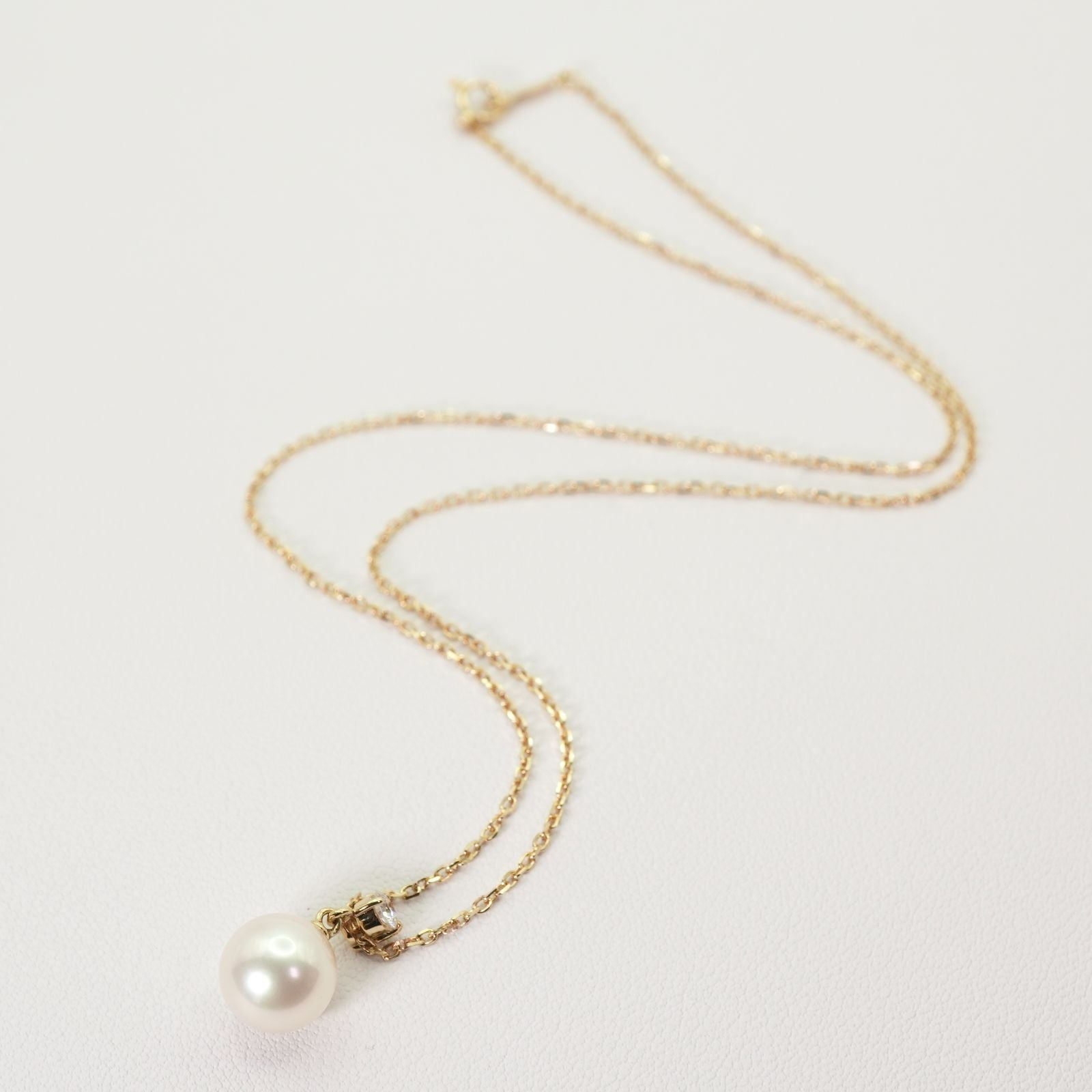 Mikimoto K18 necklace featuring an 8.3mm Akoya pearl and diamond accents, model 25-1023S