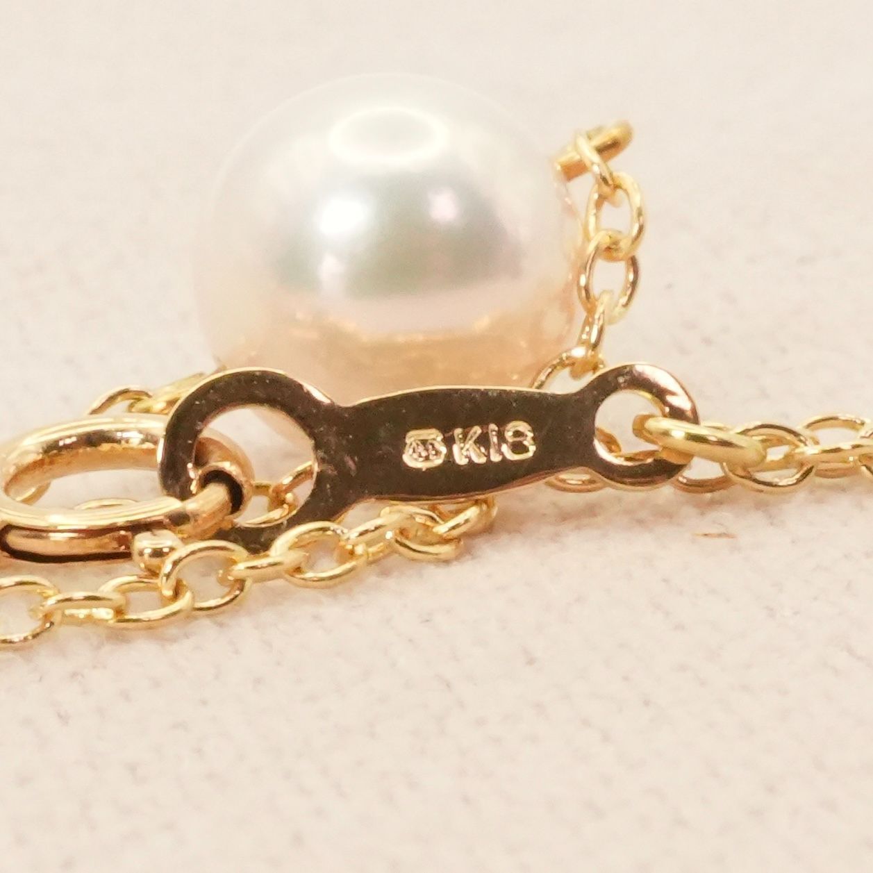 Mikimoto K18 Akoya pearl necklace model 25-420S featuring a single pearl on a gold chain