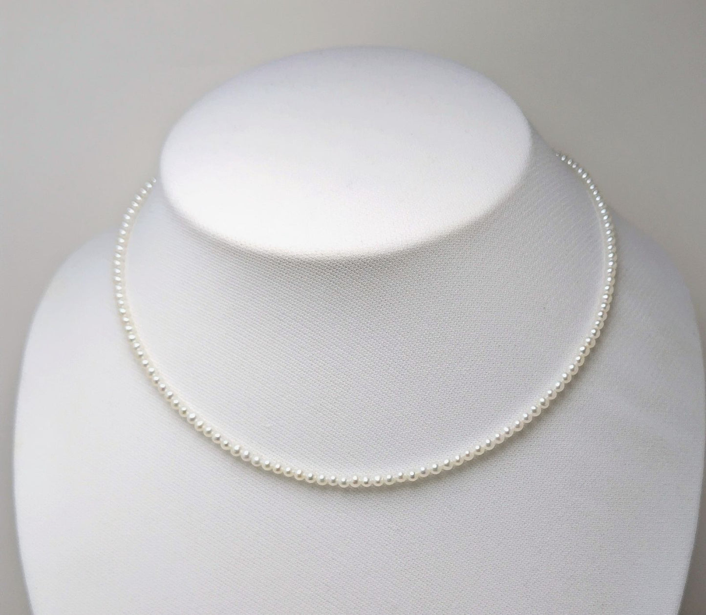 Baby 3mm white Akoya and freshwater pearl necklace with semi-round pearls and good luster