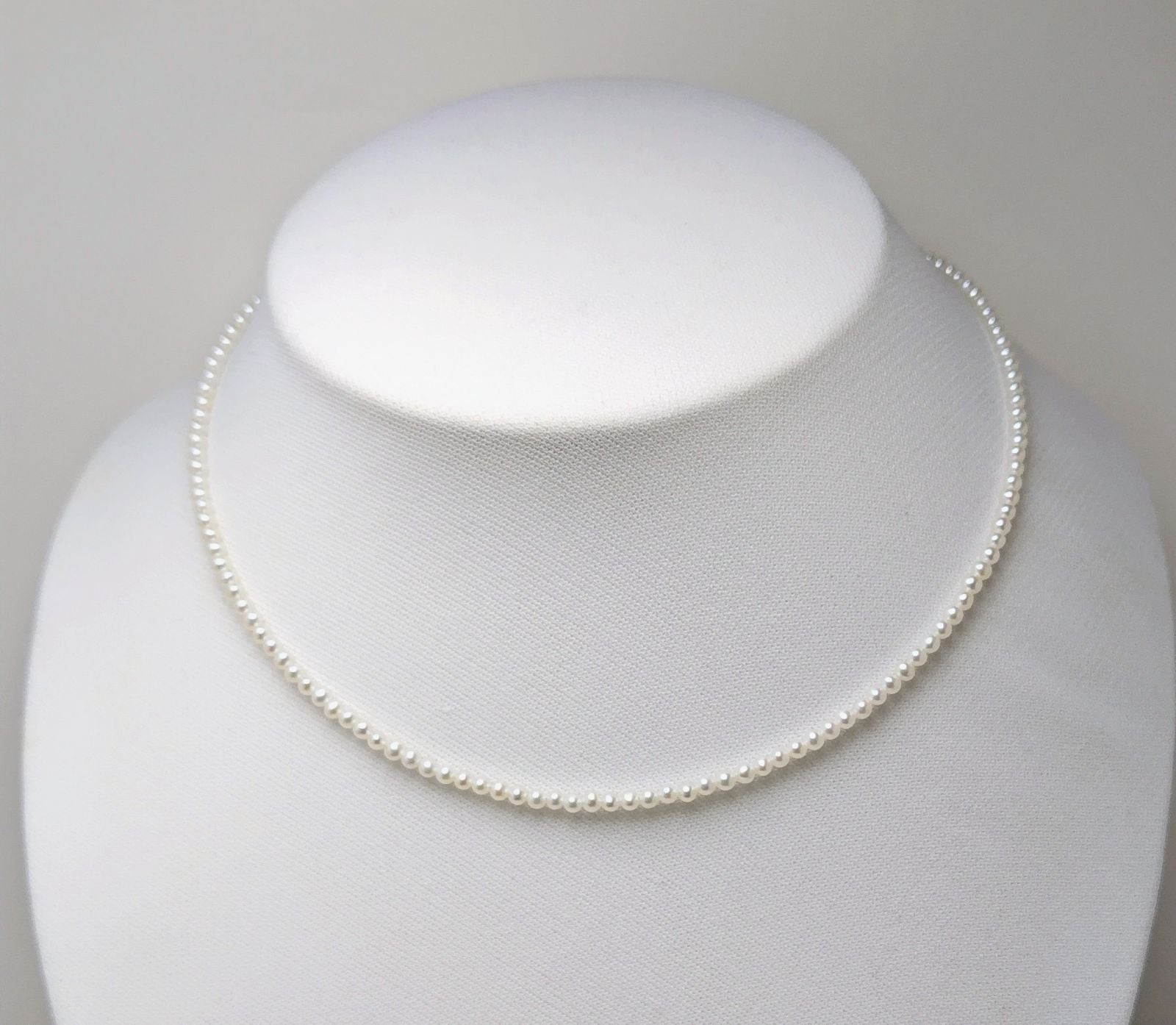 Baby 3mm white Akoya and freshwater pearl necklace with semi-round pearls and good luster
